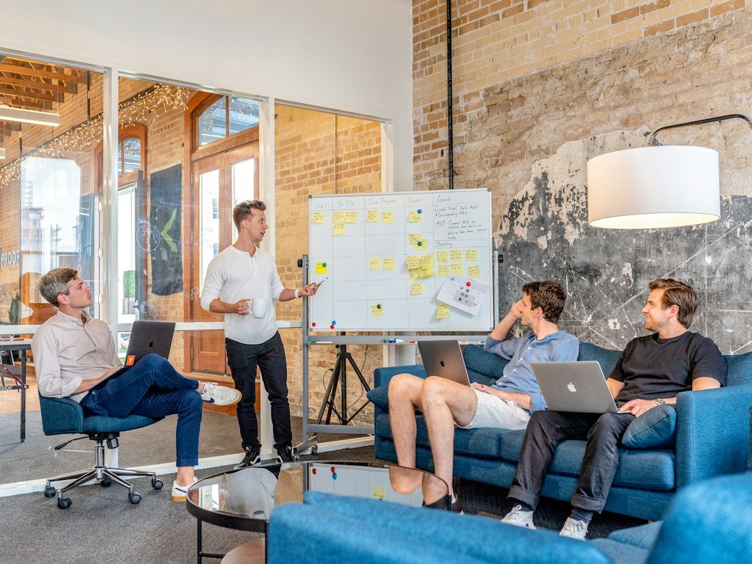 Sales team discussing CRM workflow and lead automation in an office