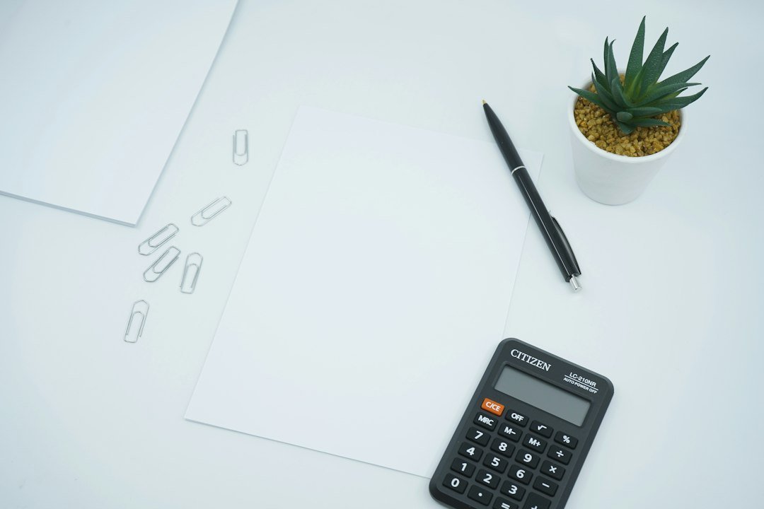 Calculator and business paperwork used during an accounts receivable review