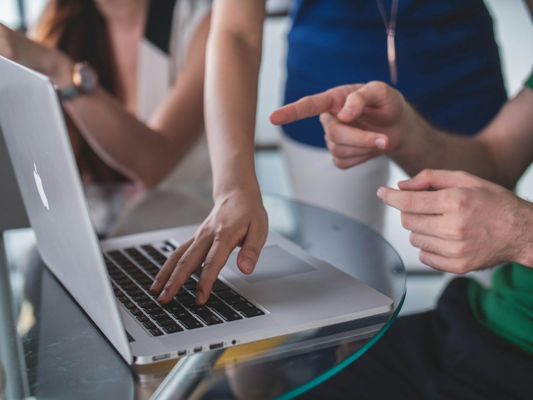Professional reviewing a business process automation workflow on a laptop
