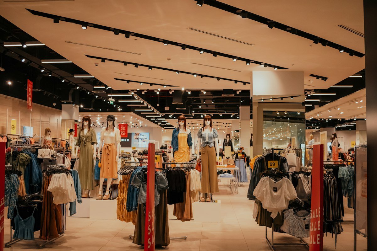 Clothing racks and mannequins in a Dubai fashion store where retail ERP tracks sizes, locations and stock