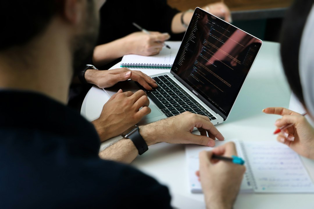 Sales team reviewing CRM lead and pipeline data on a laptop