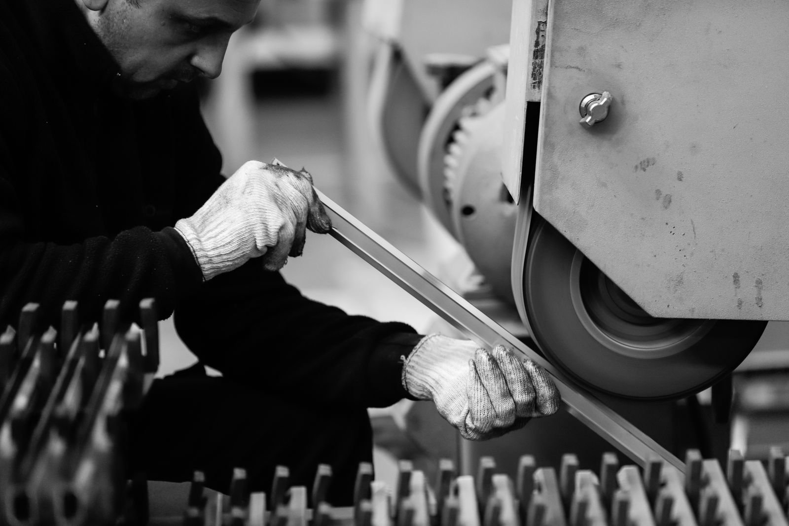 Factory technician working on industrial machinery for maintenance and production
