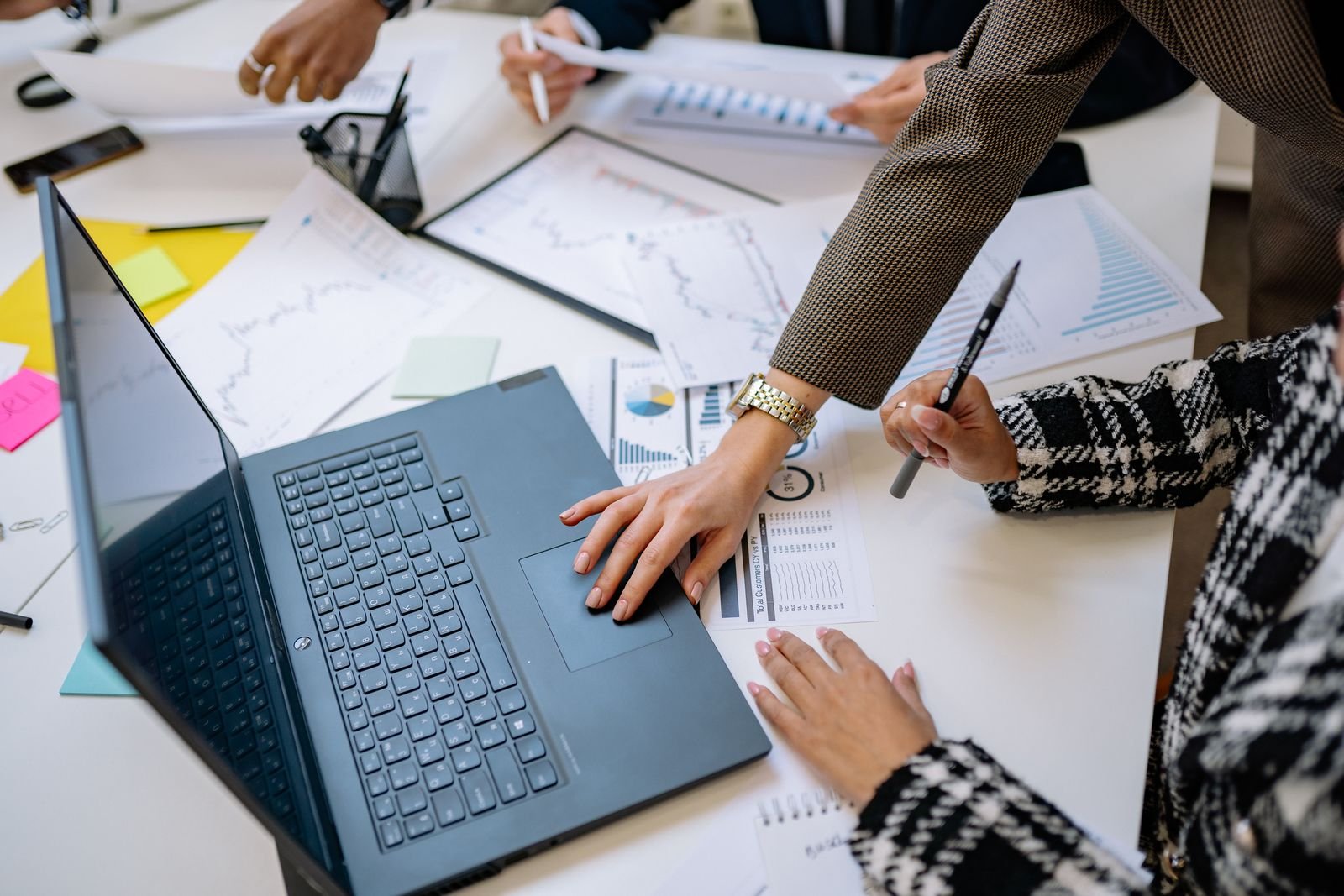 Business team reviewing analytics data and reporting requirements for a Power BI integration